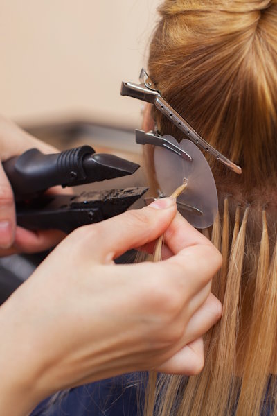 The,Hairdresser,Does,Hair,Extensions,To,A,Young,Girl,,A